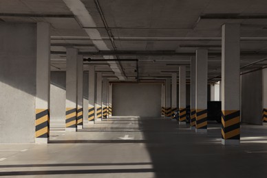 Photo of Empty open car parking garage on sunny day