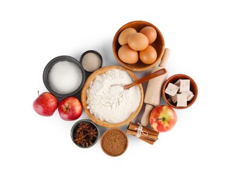 Photo of Flour, yeast cake and different ingredients on white background, top view. Making pie