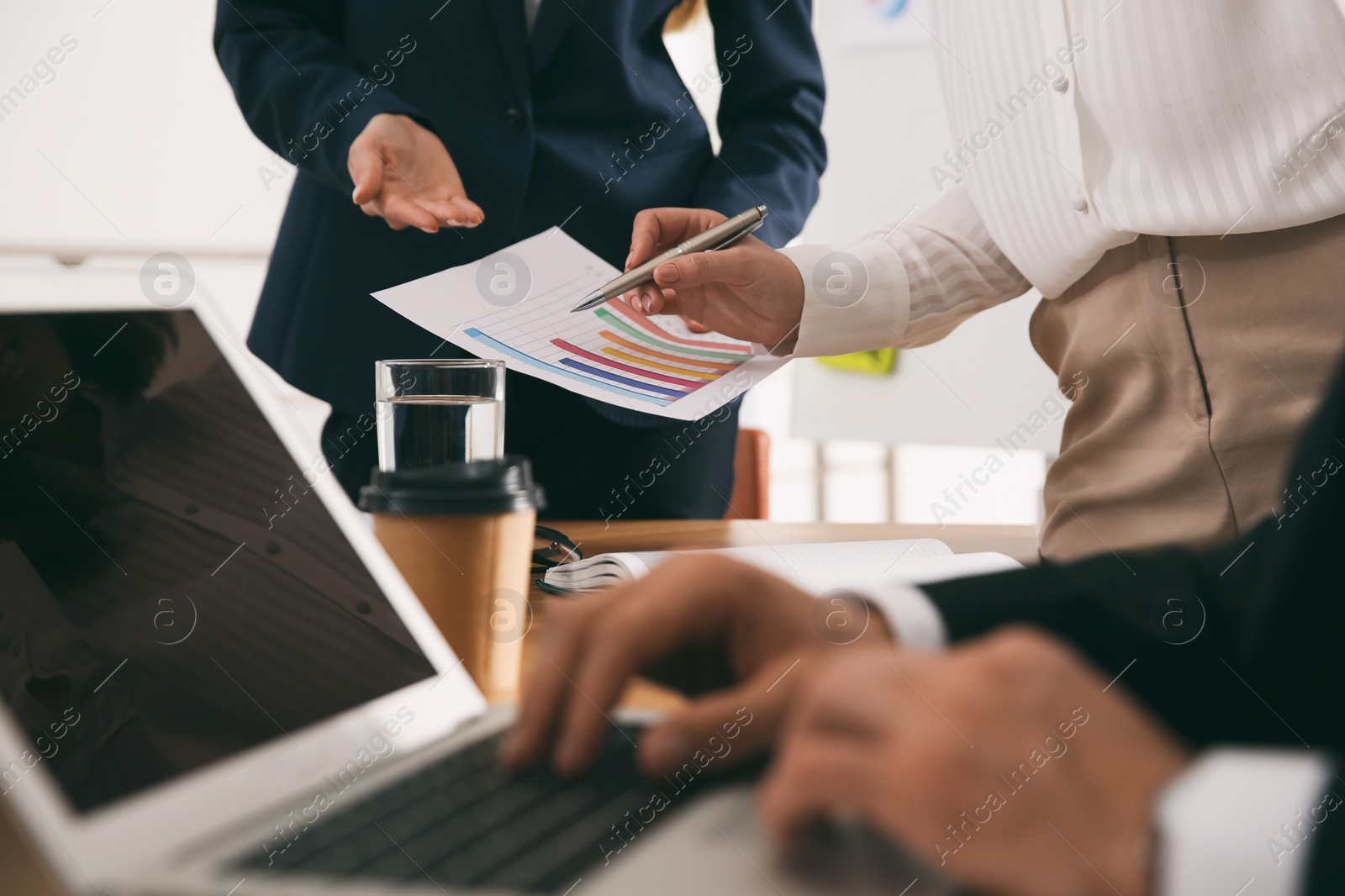 Photo of Businesspeople having meeting in office, closeup. Management consulting