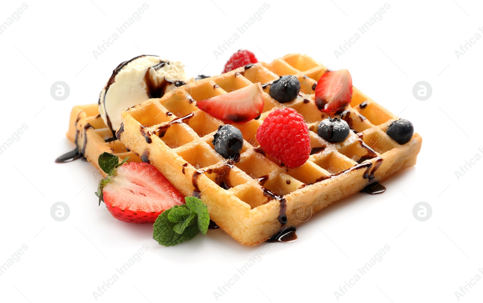 Photo of Yummy waffles with berries, ice cream and chocolate syrup on white background