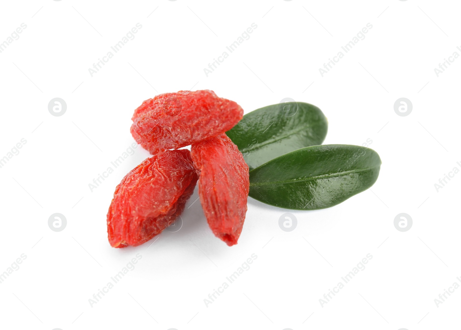 Photo of Dried goji berries and leaves on white background