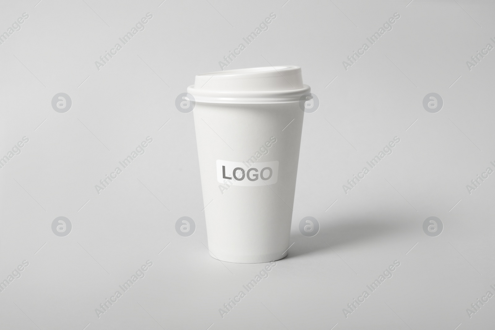 Image of Takeaway paper coffee cup with logo on light grey background