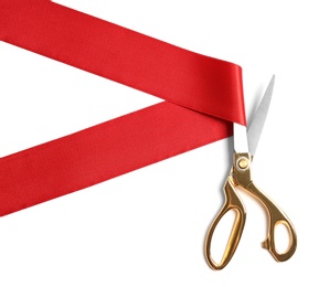 Photo of Ribbon and scissors on white background, top view. Ceremonial red tape cutting