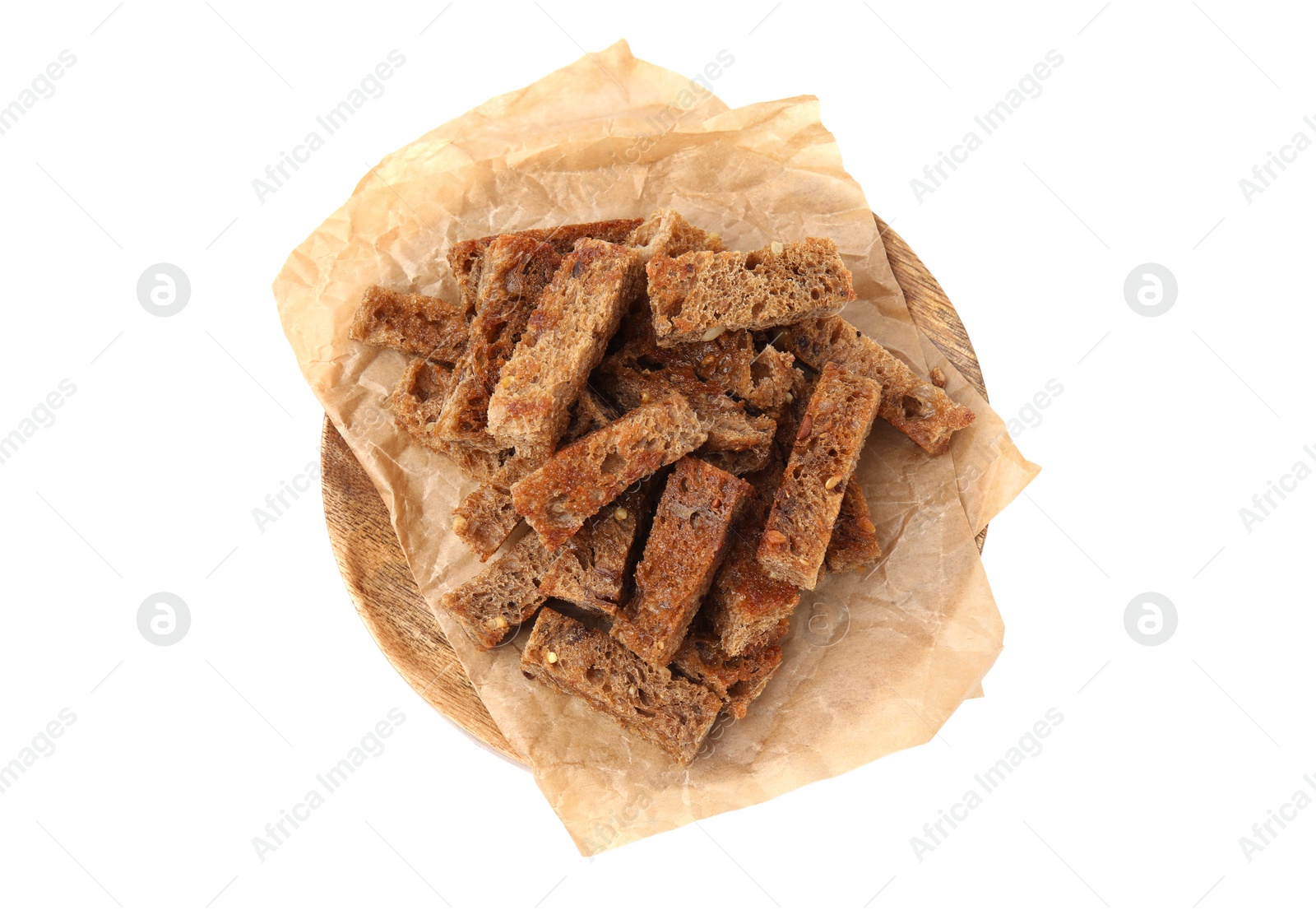 Photo of Wooden tray with crispy rusks isolated on white, top view