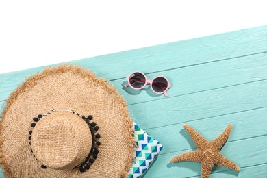 Photo of Flat lay composition with beach accessories on wooden background