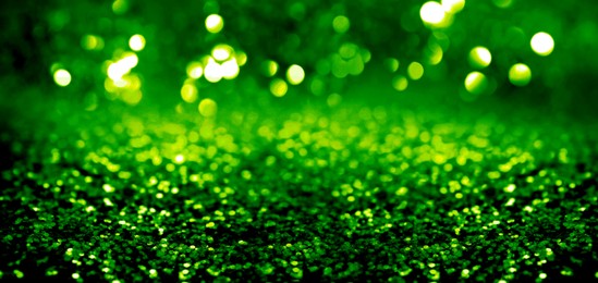 Image of St. Patrick day. Shiny green glitter, bokeh effect. Banner design