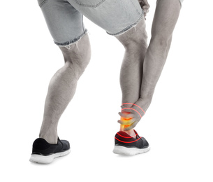 Image of Young man suffering from leg pain on white background, closeup