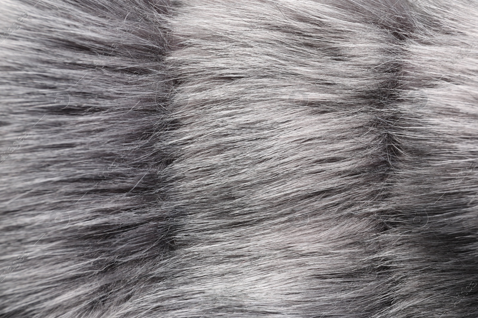 Photo of Texture of grey faux fur as background, closeup