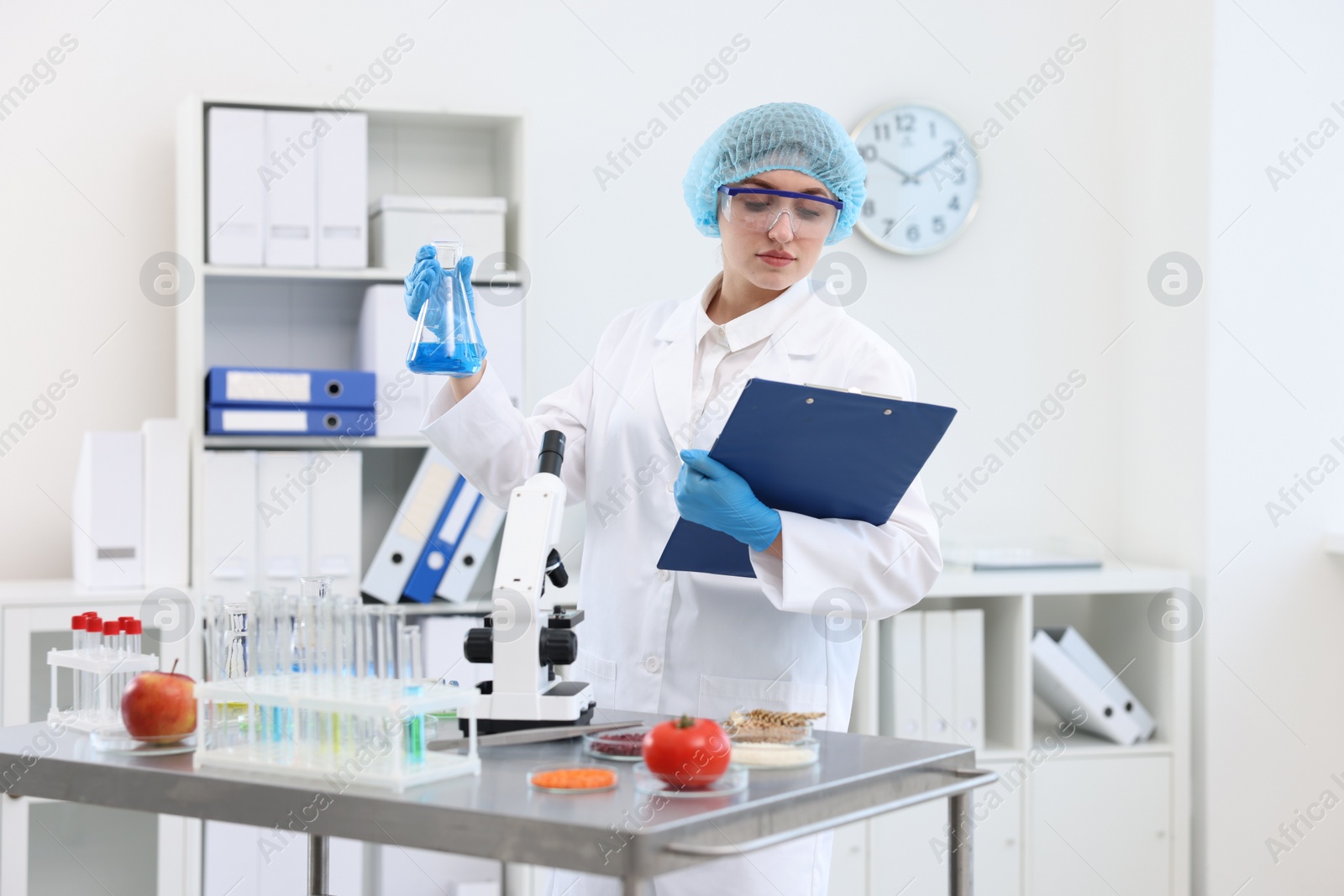 Photo of Quality control. Food inspector checking safety of products in laboratory