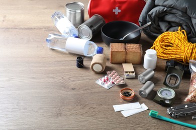 Photo of Earthquake supply kit on wooden table. Space for text