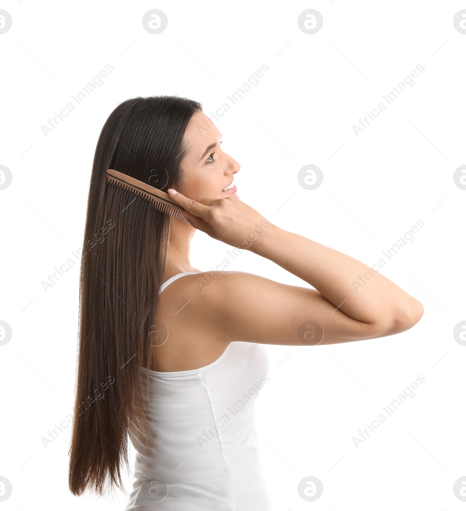 Photo of Beautiful young woman with hair comb on white background