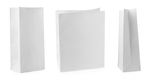 Image of Set with paper bags on white background 