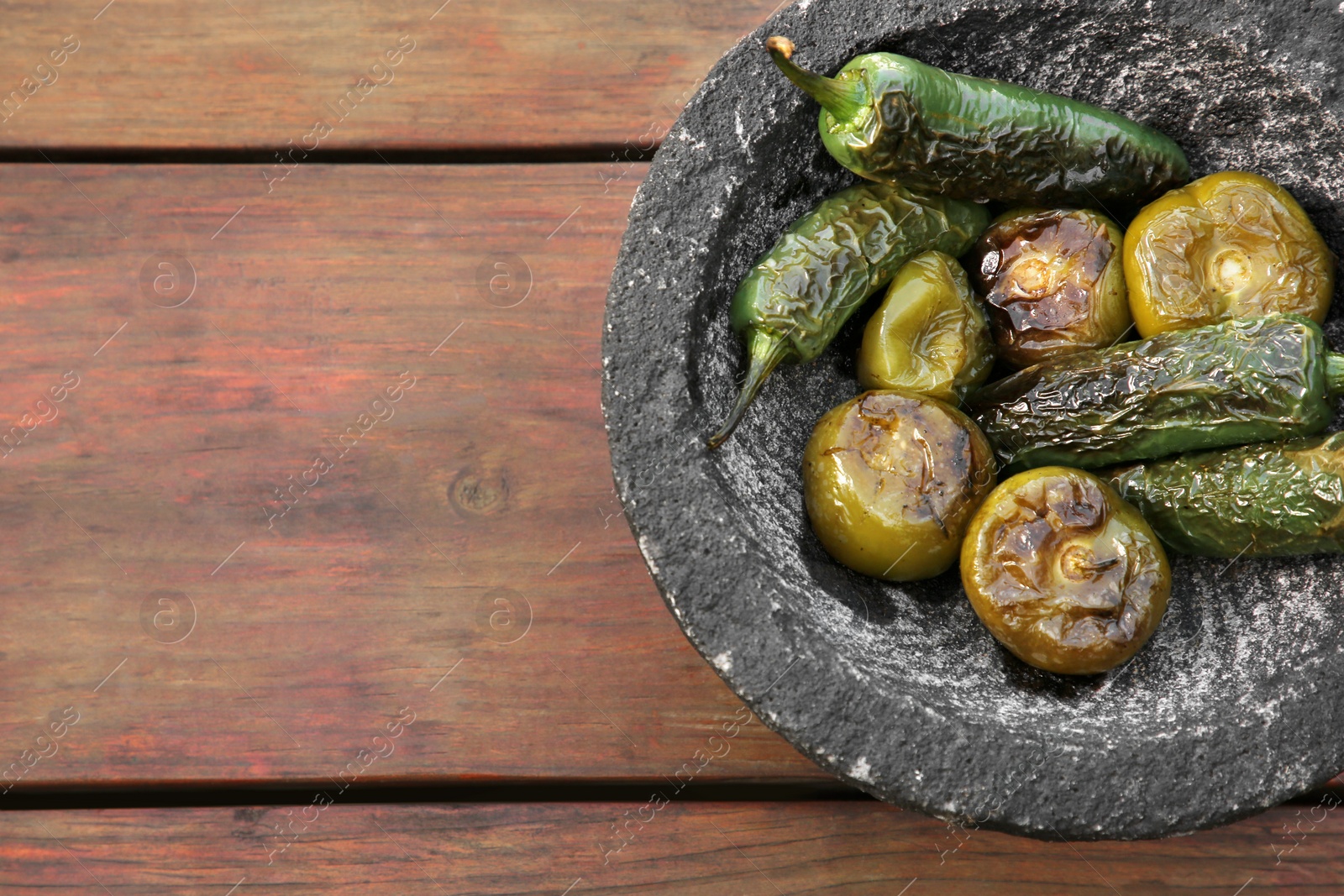 Photo of Different ingredients for cooking tasty salsa sauce on wooden table, top view. Space for text