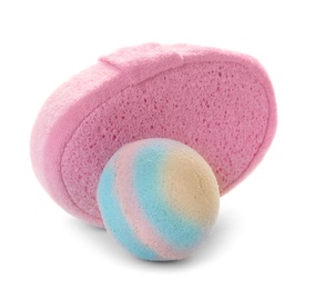 Photo of Pink sponge and bath bomb on white background