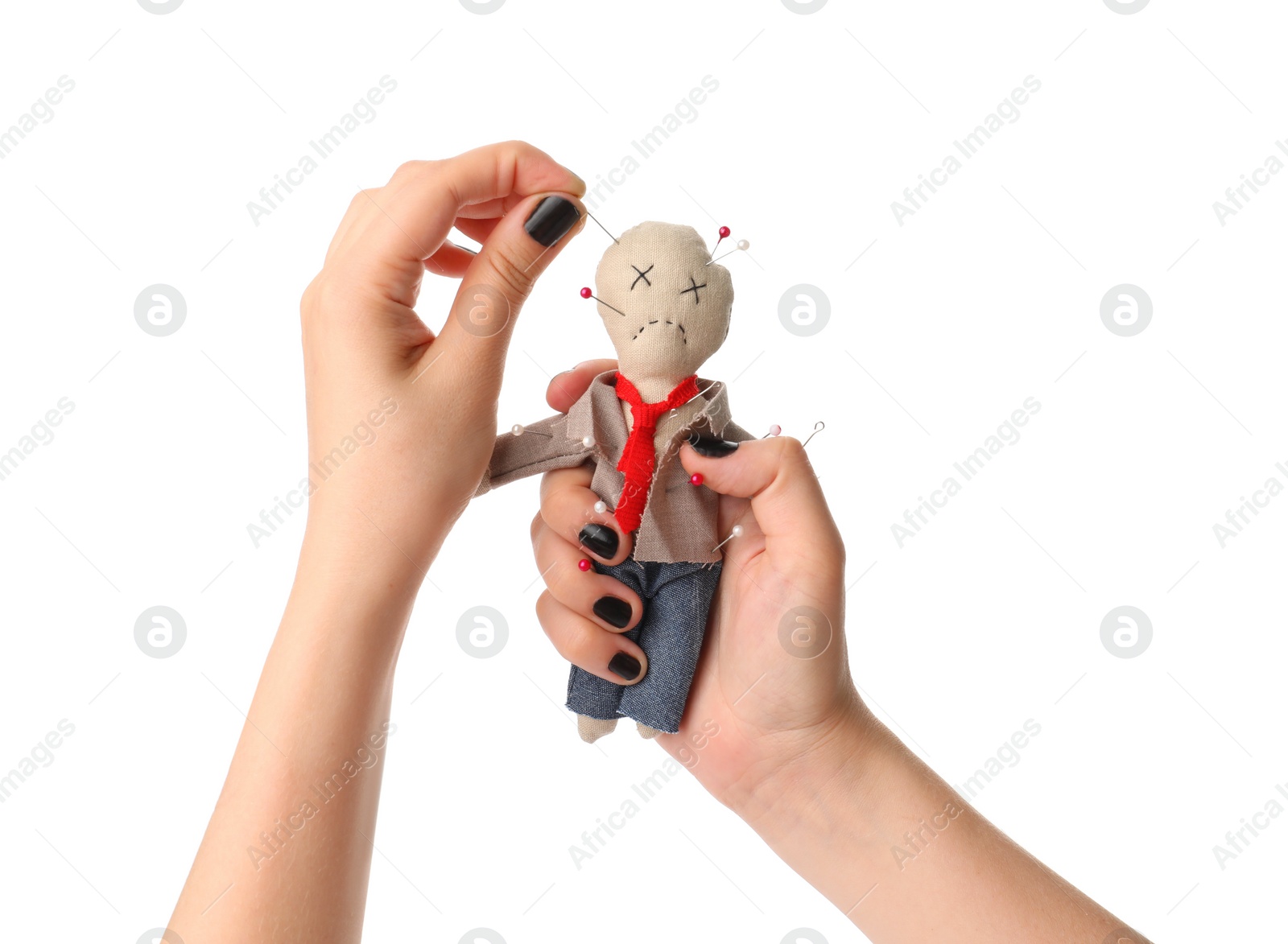 Photo of Woman stabbing voodoo doll dressed as businessman with pin on white background, closeup