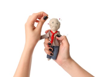 Photo of Woman stabbing voodoo doll dressed as businessman with pin on white background, closeup