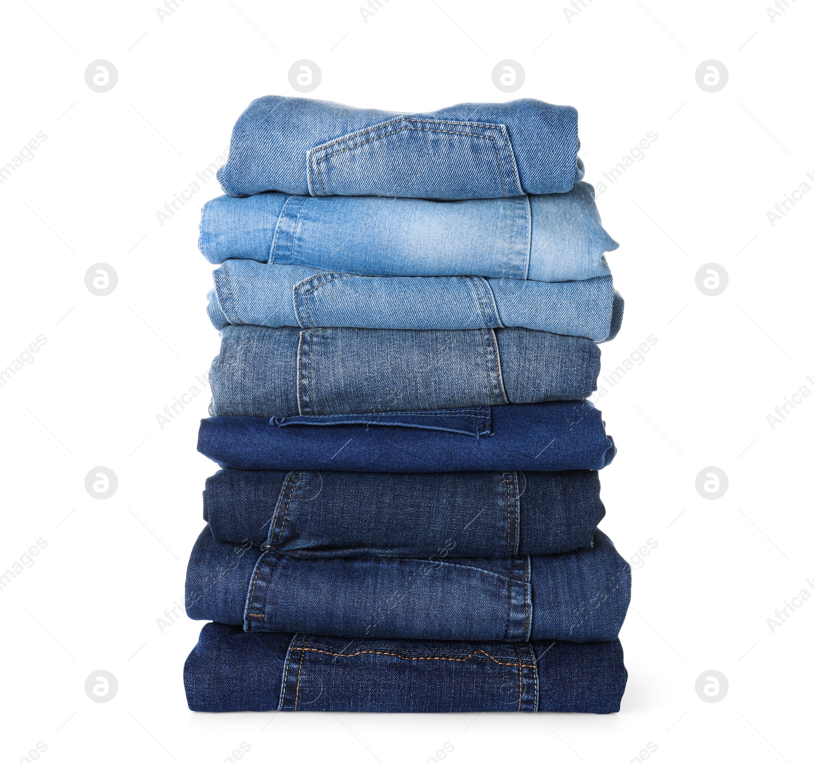 Photo of Stack of different jeans isolated on white