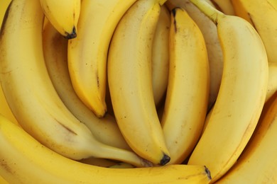 Photo of Many tasty bananas as background, closeup view