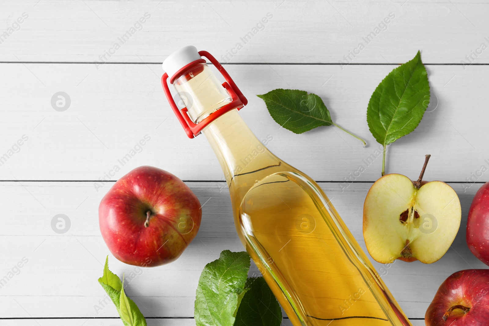 Photo of Flat lay composition with delicious apple cider on white wooden table