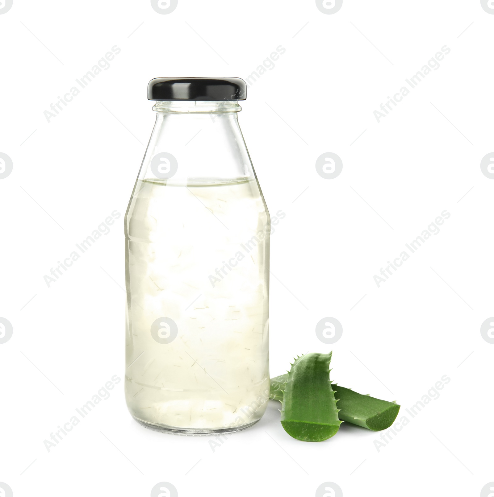 Photo of Fresh aloe drink in bottle and leaves on white background