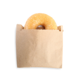 Photo of Delicious donut in paper bag isolated on white, top view