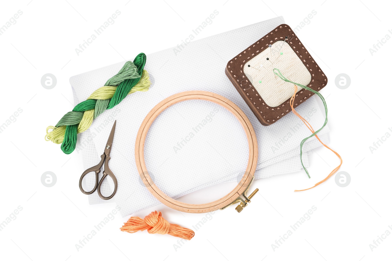 Photo of Set of embroidery equipment on white background, top view