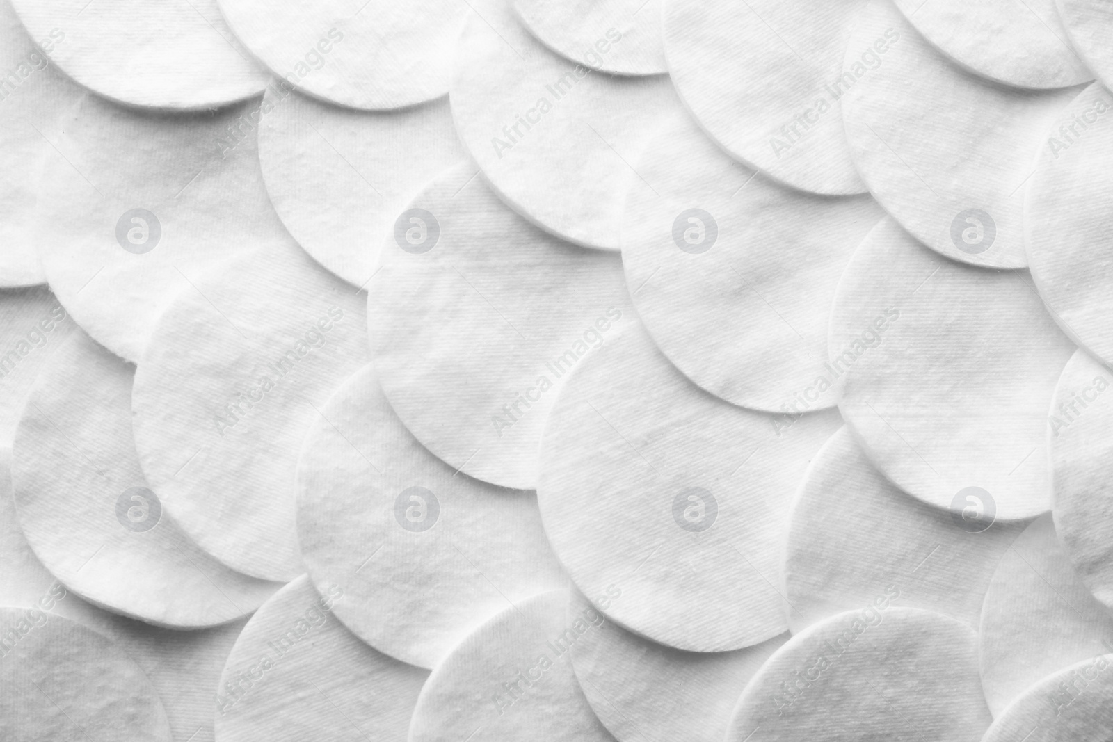 Photo of Many cotton pads as background, top view