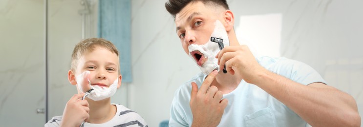 Image of Dad shaving and son imitating him in bathroom. Banner design