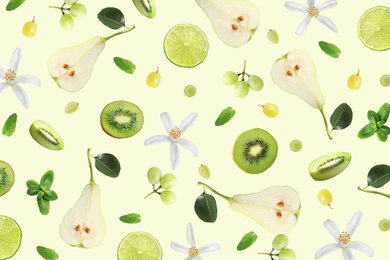 Image of Tropical layout with fresh exotic fruits and mint leaves on pale light green background, top view