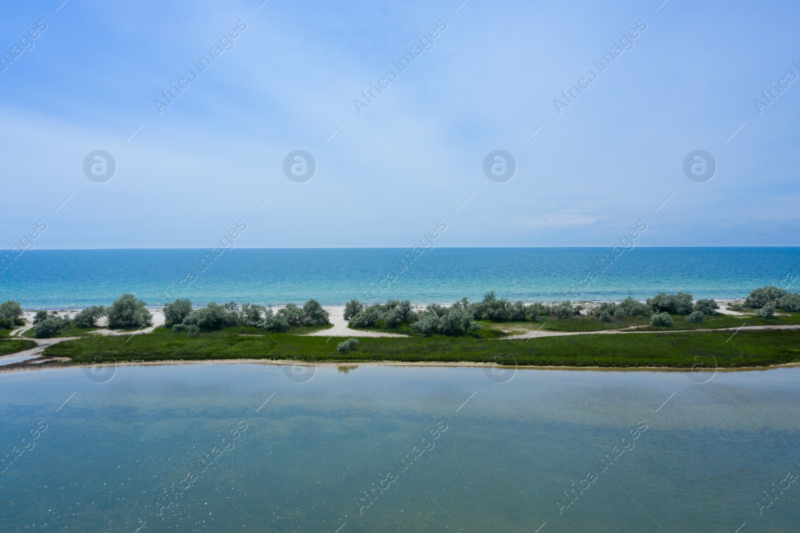 Image of Beautiful aerial view of isthmus with green plants surrounded by sea