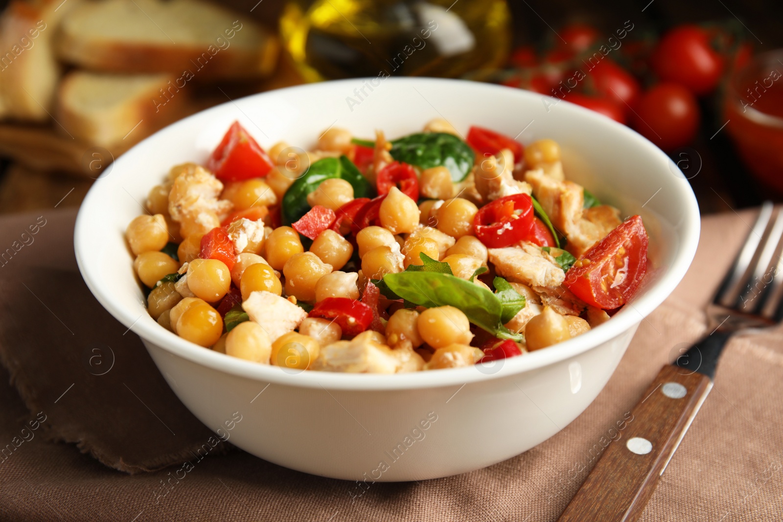 Photo of Delicious fresh chickpea salad served on table