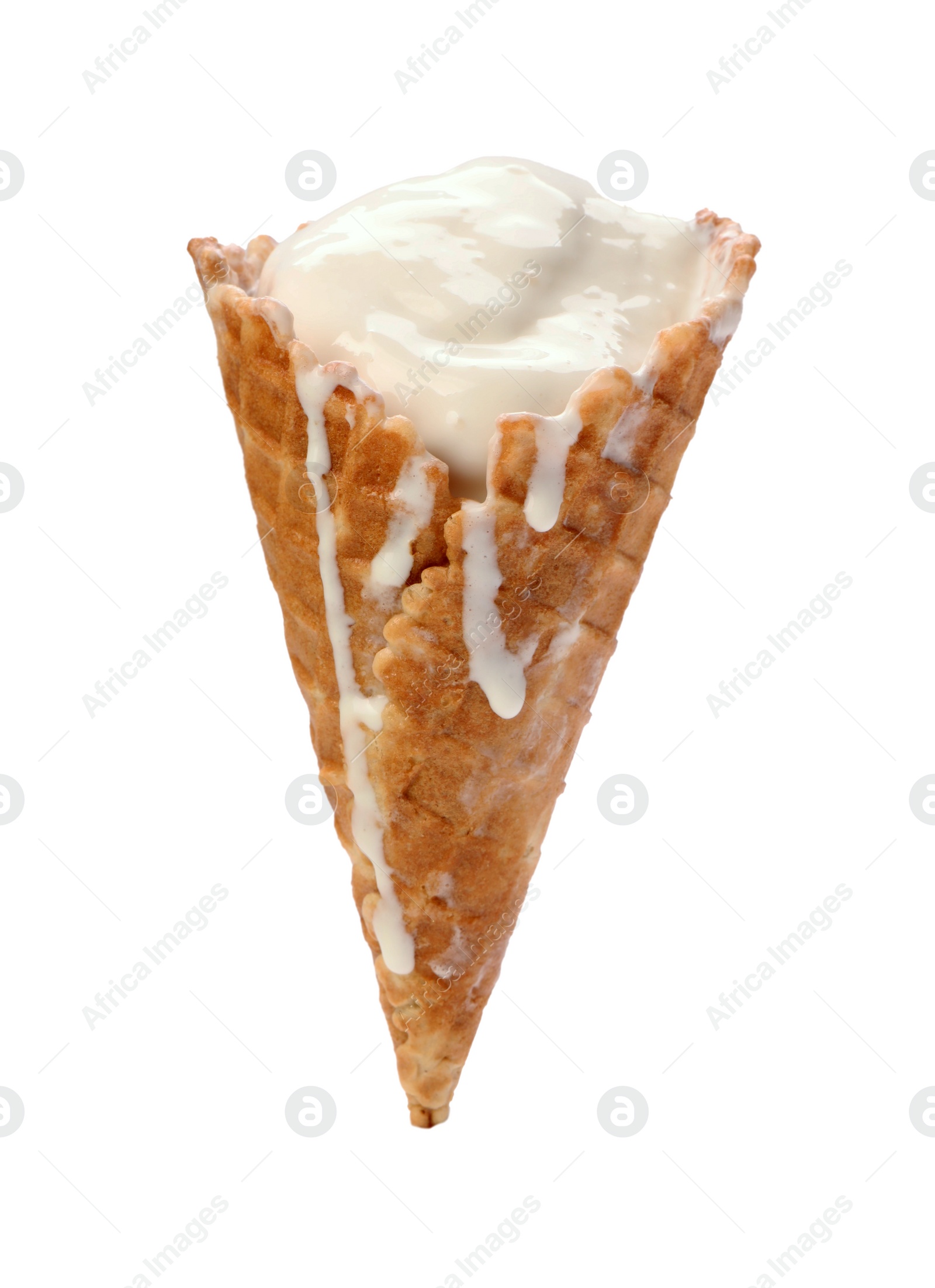 Photo of Melting ice cream in wafer cone isolated on white