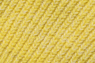 Texture of soft yellow fabric as background, top view
