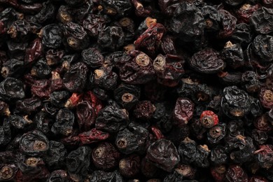 Photo of Heap of tasty dried currants as background, top view