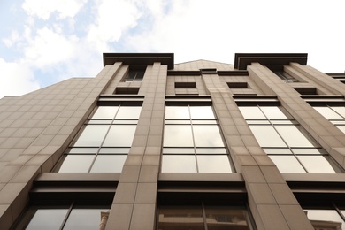 Modern office building with tinted windows on sunny day