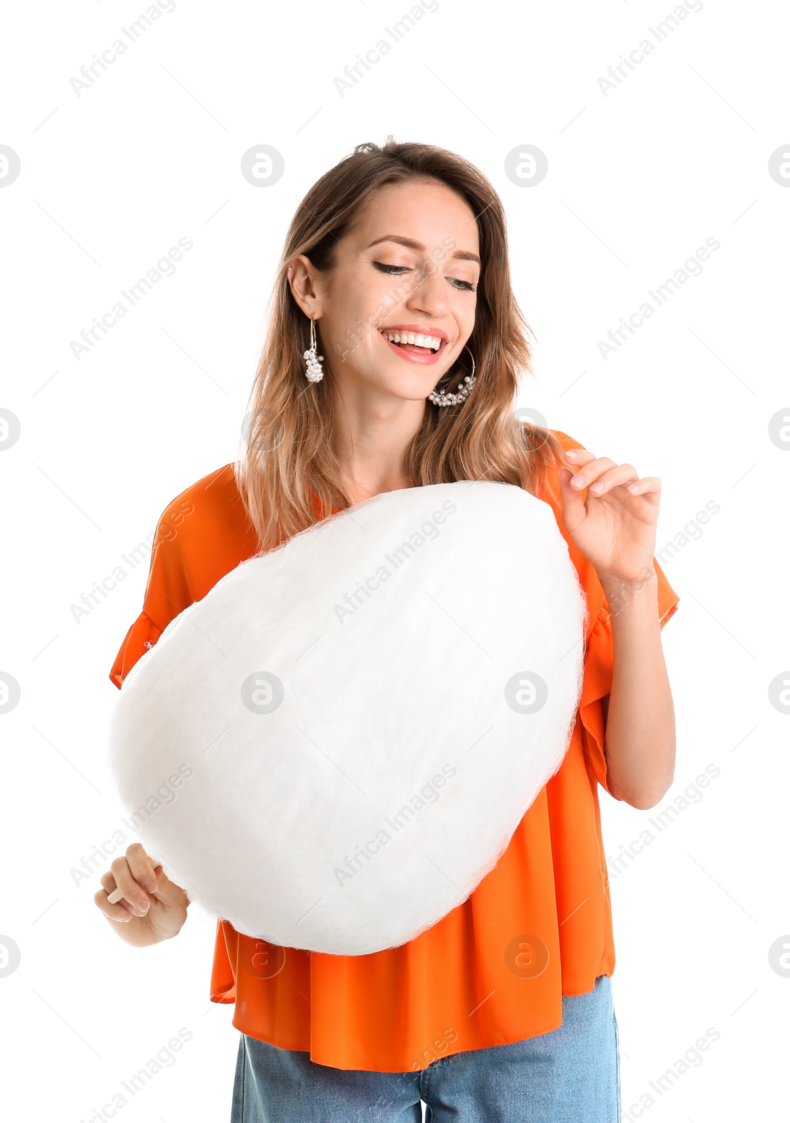 Photo of Happy young woman with cotton candy on white background