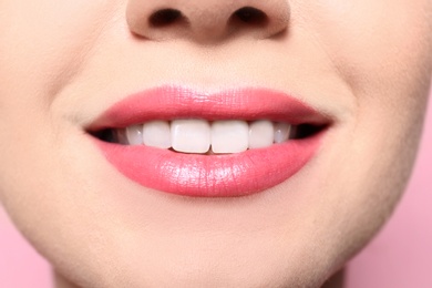 Photo of Beautiful young woman with perfect lips makeup on color background, closeup