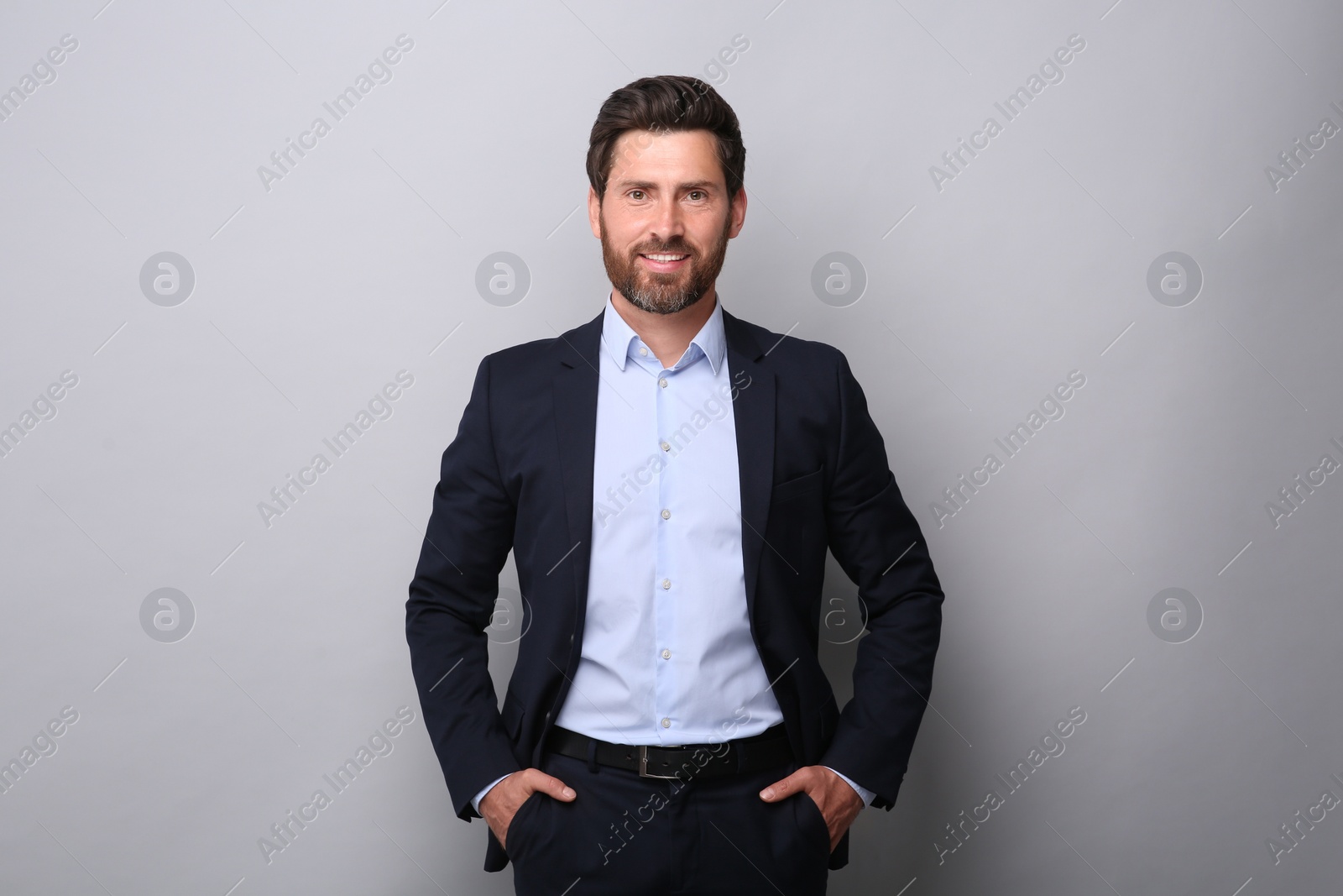 Photo of Portrait of handsome man on light grey background
