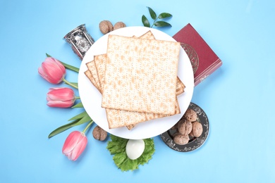 Photo of Composition with symbolic Passover (Pesach) items on color background, top view