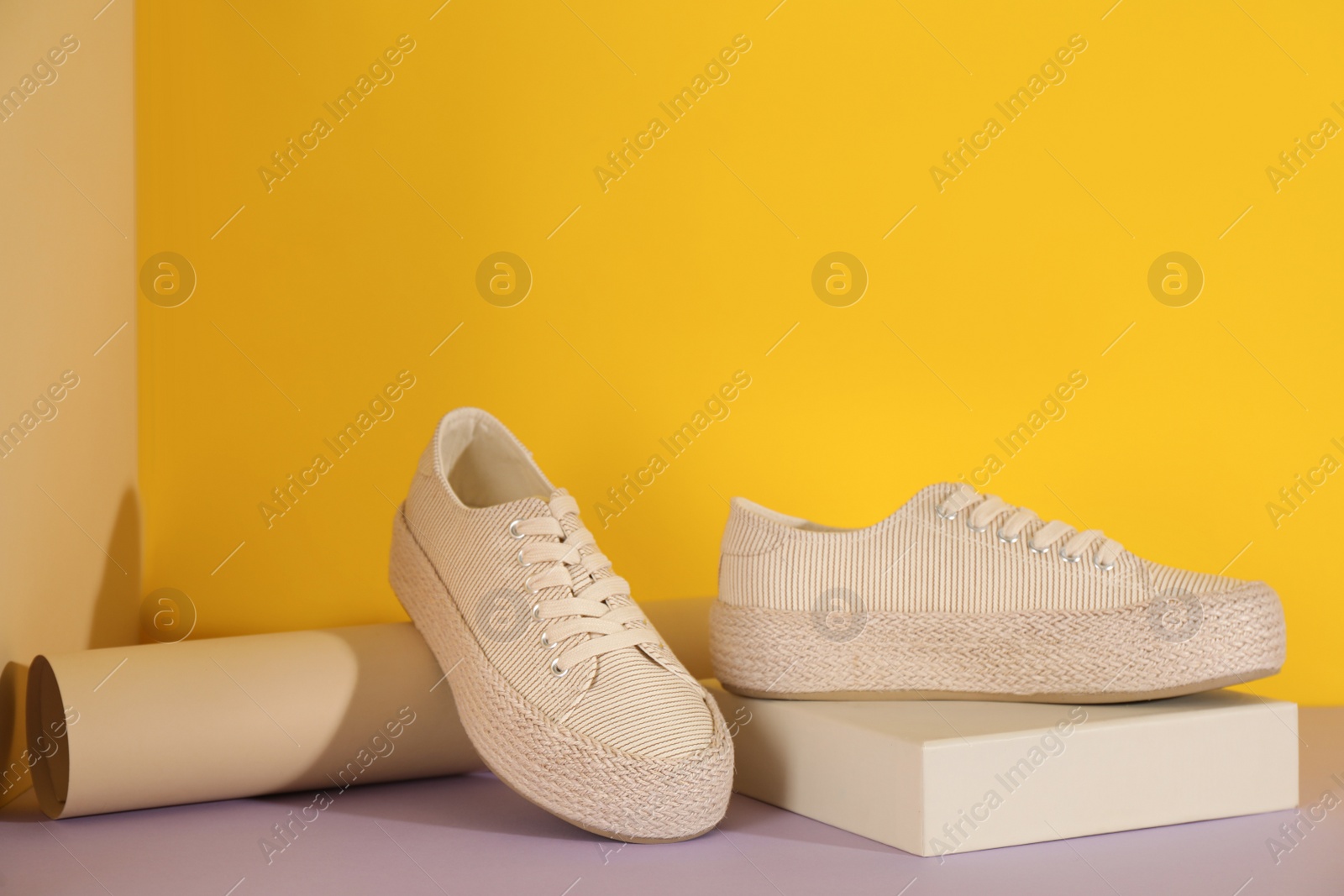 Photo of Pair of stylish sneakers on color background. Space for text