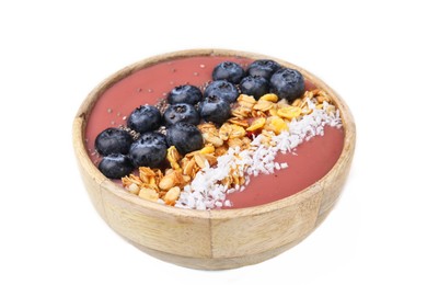 Photo of Bowl of delicious fruit smoothie with fresh blueberries, granola and coconut flakes isolated on white