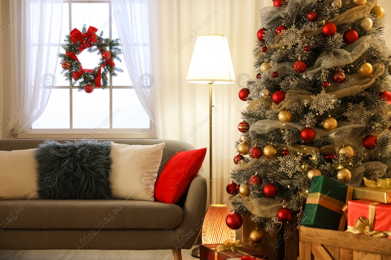 Photo of Beautiful living room interior with decorated Christmas tree