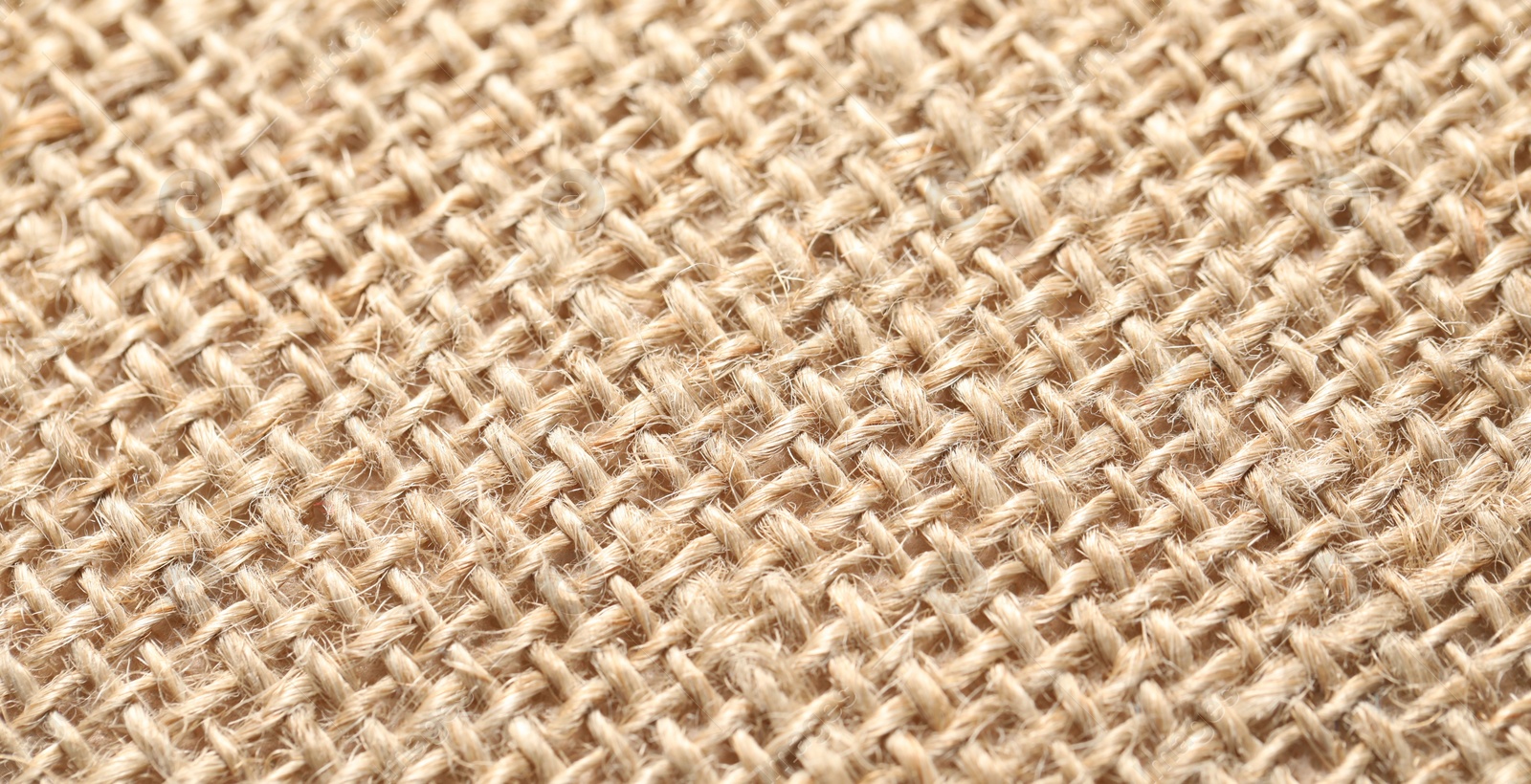 Photo of Texture of beige fabric as background, closeup