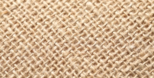 Photo of Texture of beige fabric as background, closeup