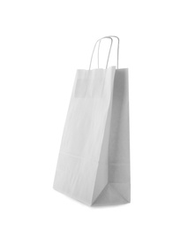 Photo of Mockup of paper shopping bag on white background