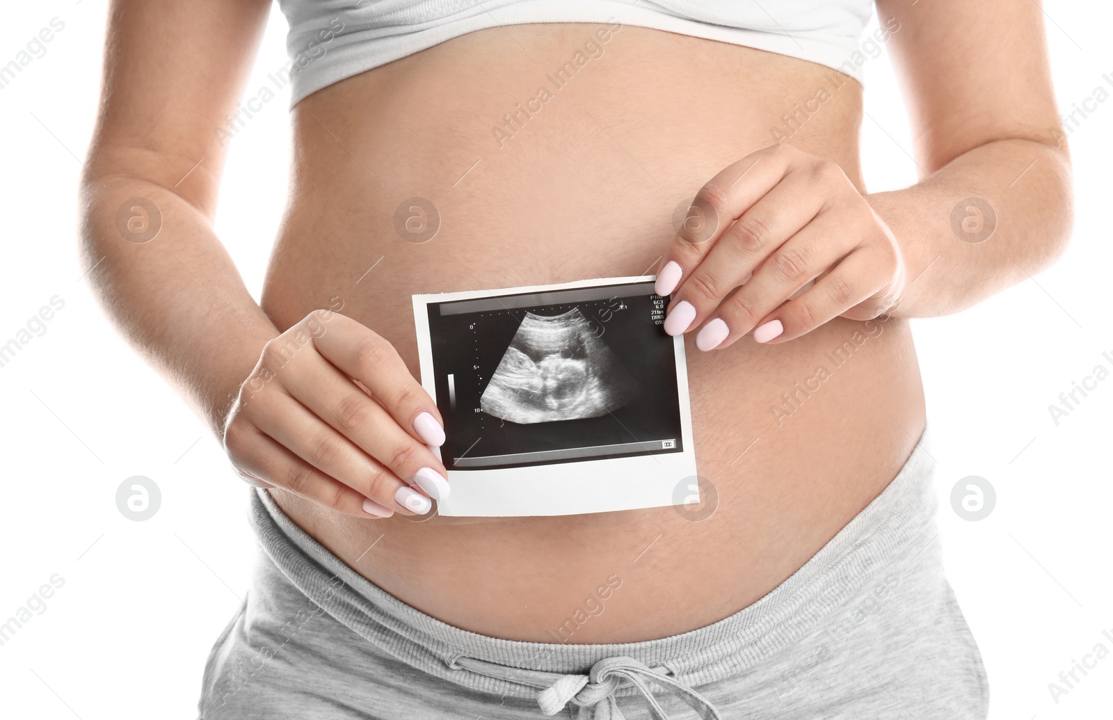 Photo of Pregnant woman with ultrasound picture on white background, closeup