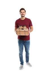 Photo of Young courier with pizza boxes and drinks on white background. Food delivery service