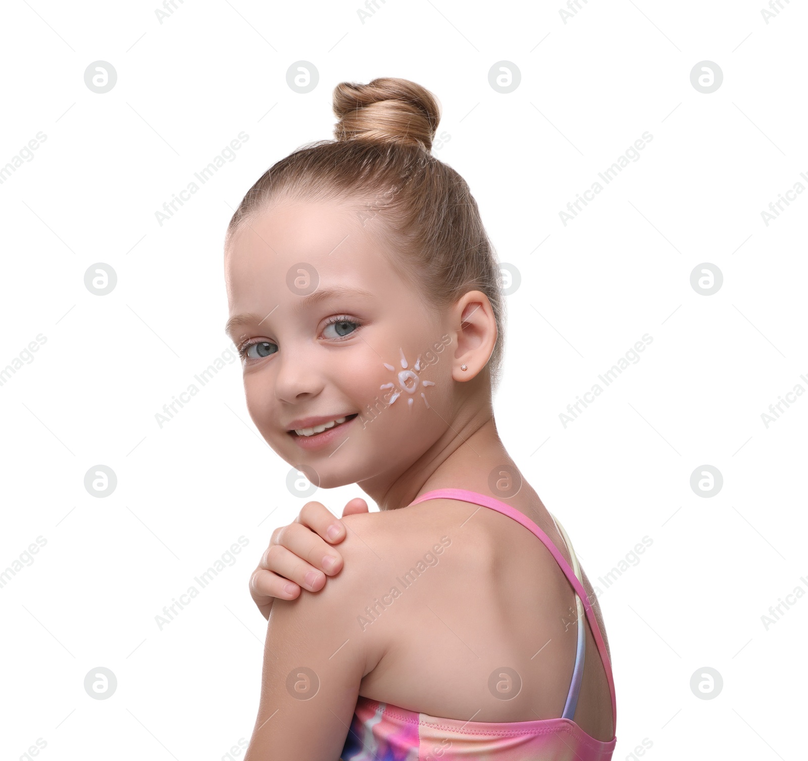 Photo of Happy girl with sun protection cream on her face isolated on white