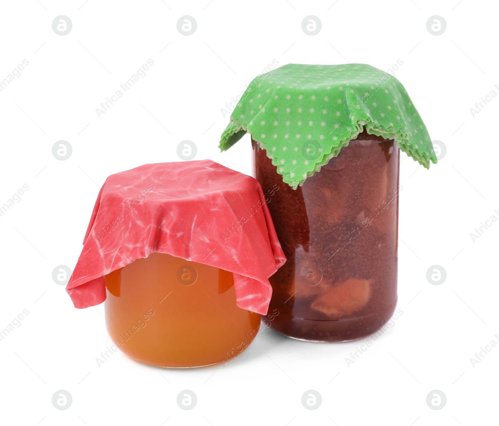 Photo of Jars of tasty jam covered with beeswax food wraps on white background