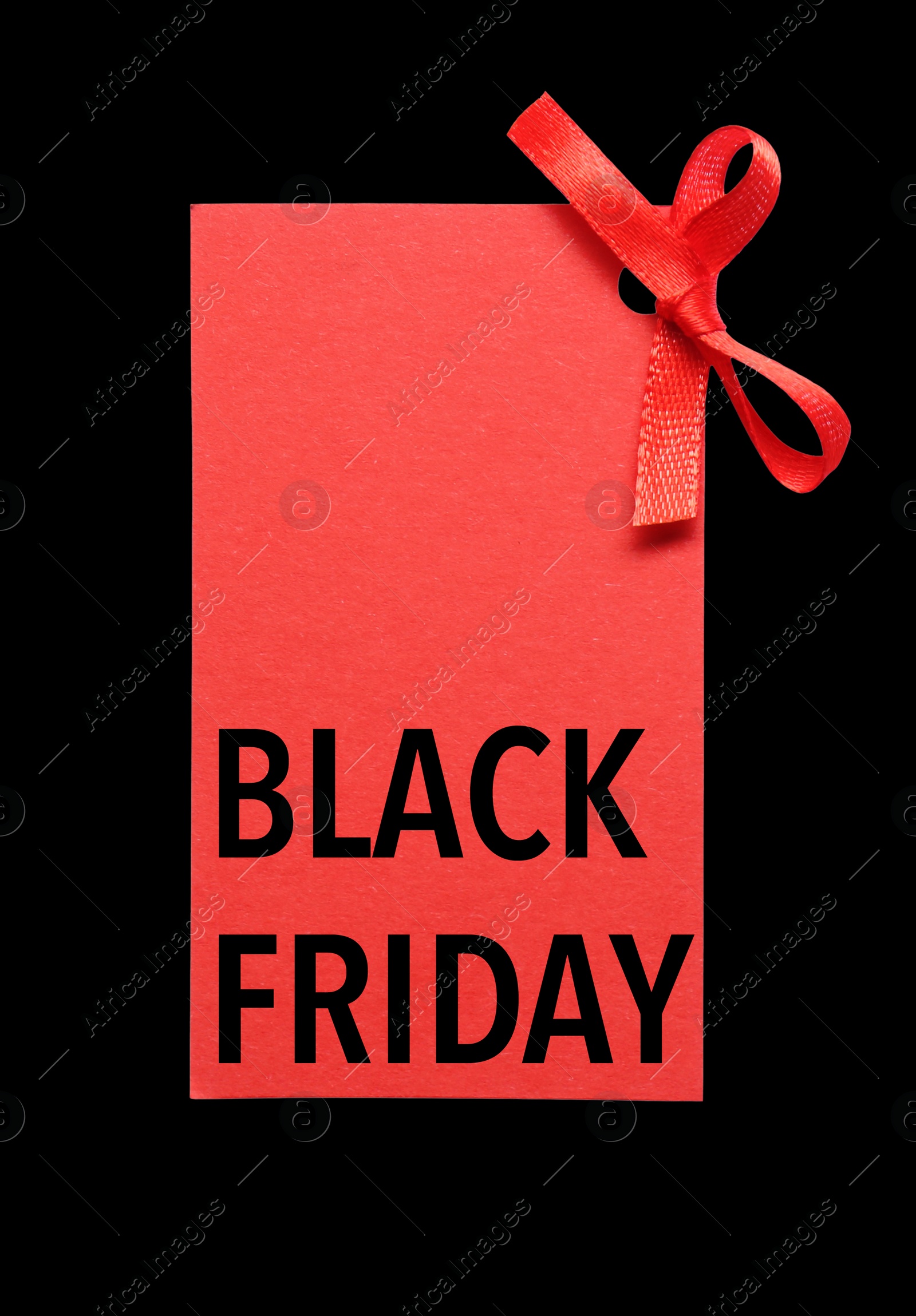 Image of Red tag with phrase BLACK FRIDAY on dark background, top view